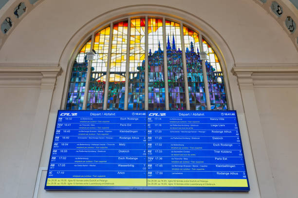 Luxembourg city, Luxembourg- August 19, 2018: Terminal Luxembourg railway station with information panel and stained-glass window of skyline luxembourg