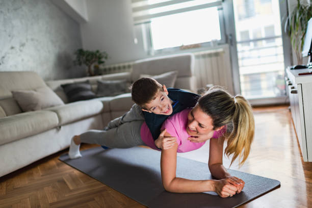 istock Mother practicing yoga with toddler boy at home 1216623269