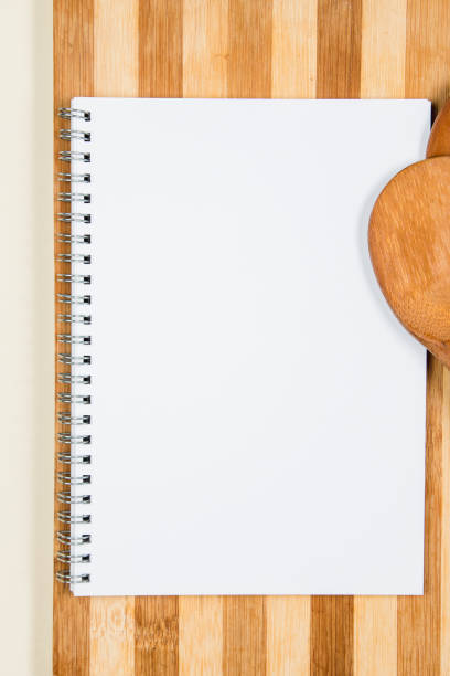 istock Wooden cutting board with wooden spoons on a table 1216623418