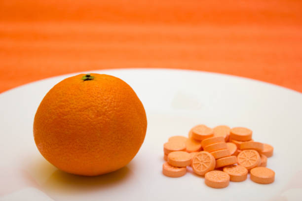 istock Tablets and orange - vitamin, protection, coronavirus, covid19 1216625976