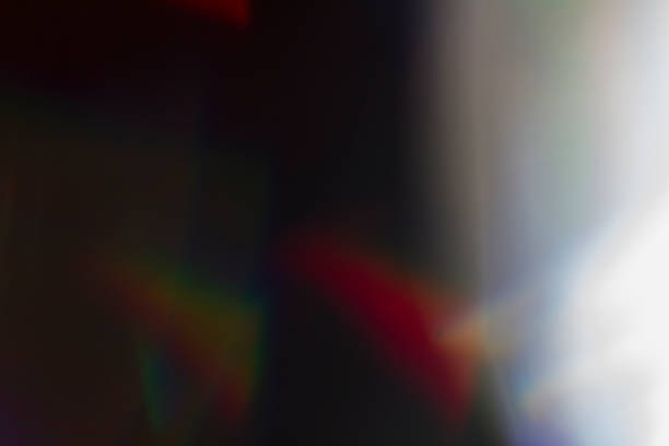 istock Lens flare and light leak haze on black background 1216628155