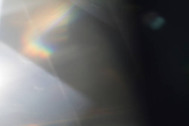 istock Lens flare and light leak haze on black background 1216628222