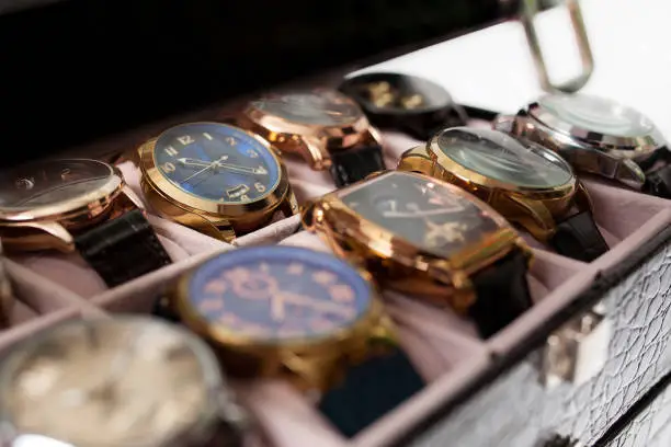 Photo of storage box with collection of men wrist watches