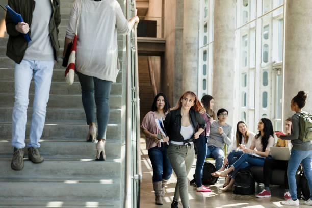 istock College students on the move on a busy campus 1216637629
