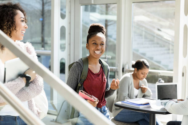 istock Happy female college students on the move 1216637660