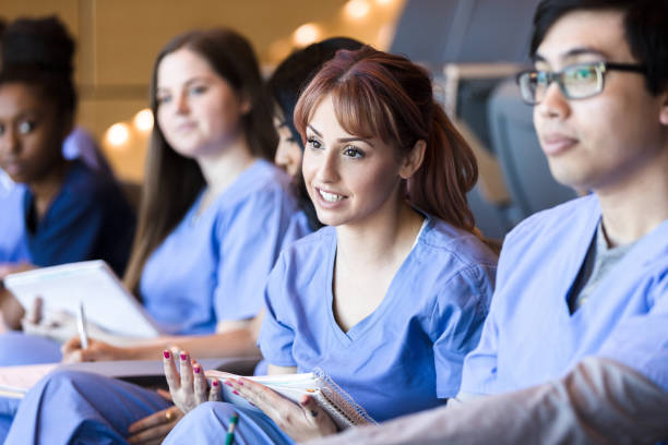 istock Female nursing student attends class with friends 1216638591