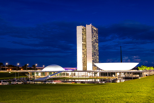 Brasilia, Brazil - March 12, 2020: Brazil's National Congress in Brasilia. Like many buildings in Brasilia, the National Congress was designed by Oscar Niemeyer, a key figure in the development of modern architecture.