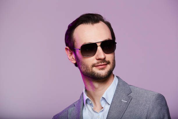 istock Studio portrait of handsome elegant young man in grey jacket 1216640615