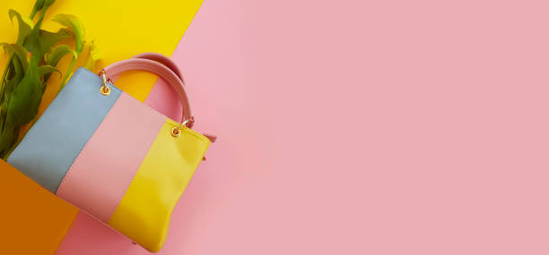 istock women bag, flowers on a colored background 1216643895