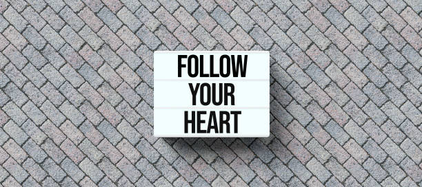 istock lightbox with message FOLLOW YOUR HEART on stone background - 3D rendered illustration 1216645211