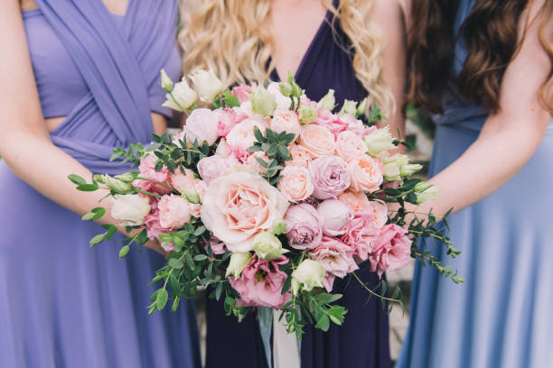 istock Bride and Bridesmaids holding Bouquets 1216645494