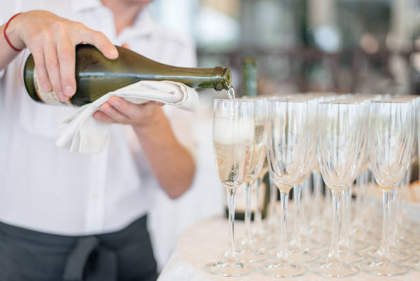 istock ?hampagne glasses on a party table. Wedding stand-up meal 1216645527