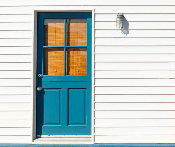 istock Blue door and white wall in San Diego 1216647335