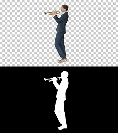 On Alpha Matte. Wide shot. Side view. Musician in a suit playing a trumpet, Alpha Channel. Professional shot.