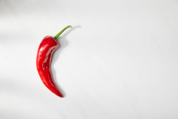 istock Top view of chili pepper on white background 1216649499