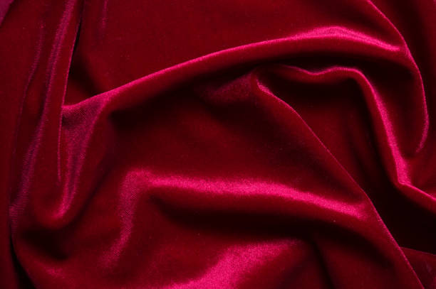 istock close up of Red cloth waves background texture 1216649704