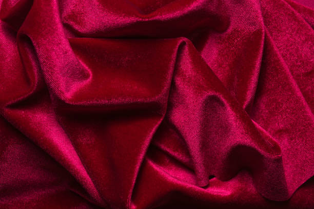 istock close up of Red cloth waves background texture 1216649713