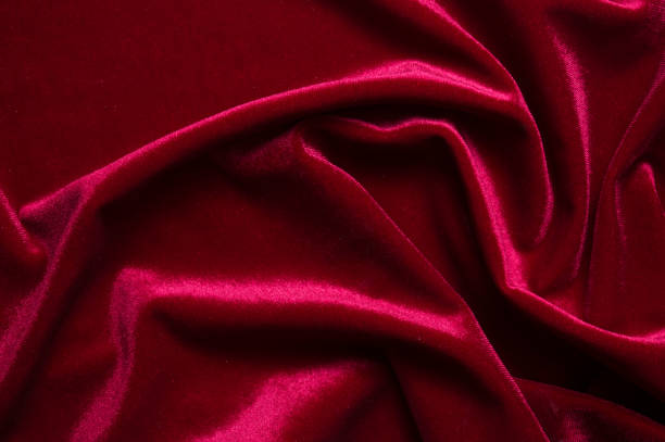 istock close up of Red cloth waves background texture 1216649724