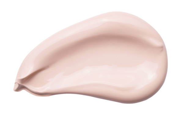 istock liquid creamy foundation isolated on white background. 1216649753