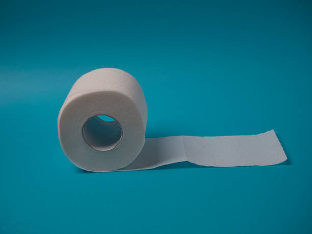 istock Toilet paper roll on a blue background close up with copy space. 1216650100