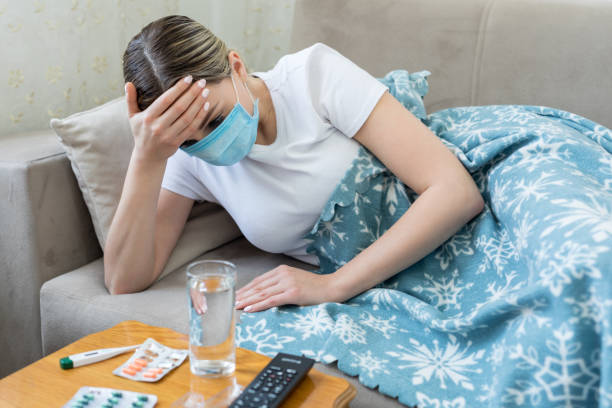 sick woman having flu or cold - estado médico imagens e fotografias de stock