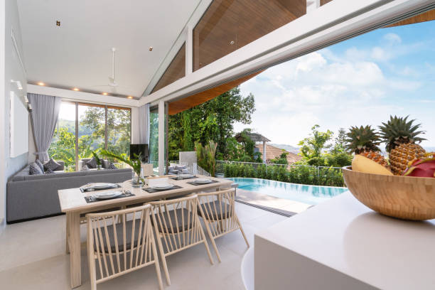 istock Interior design in pool villa, house and home feature dining table and dining chair in dining room with pool view 1216654191