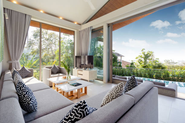 istock Interior design in villa, house, home, condo and apartment feature sofa, middle tale and television in living room with view 1216654233