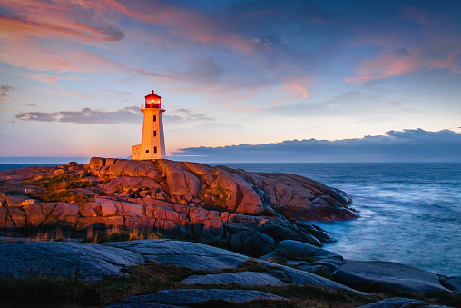 Famous Peggy's Cove Lighthouse at Sunset Twilight. Peggy's Cove, Nova Scotia, Canada.