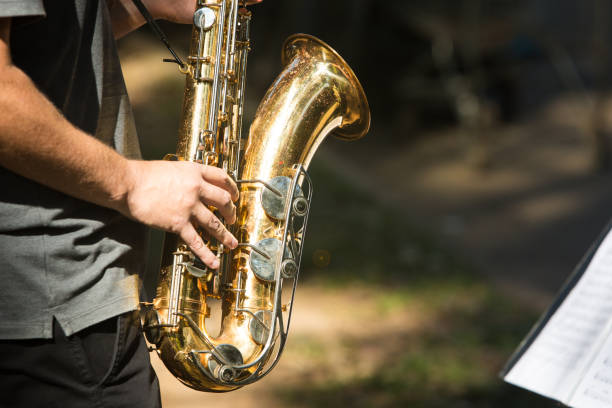 istock Street musician playing saxophone on a sunny day 1216657381