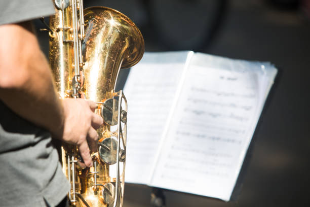 istock Street musician playing saxophone on a sunny day 1216657394