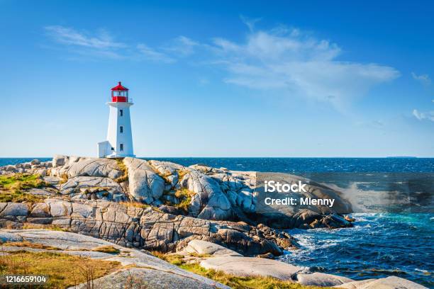 Peggys Cove Lighthouse Under Summer Sky Nova Scotia Canada Stock Photo - Download Image Now
