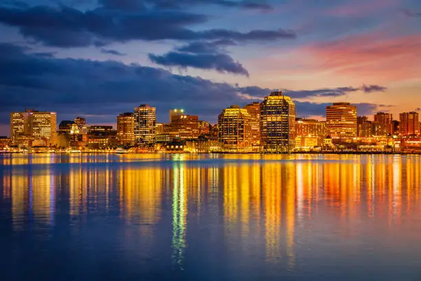 Nova Scotia Halifax Skyline. Cityscape reflections under colorful sunset twilight. Halifax, Nova Scotia, Canada