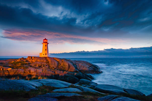 istock Peggy's Cove Lighthouse Dramatic Sunset Twilght Nova Scotia Canada 1216659213