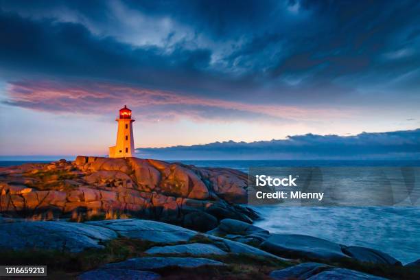 Peggys Cove Lighthouse Dramatic Sunset Twilght Nova Scotia Canada Stock Photo - Download Image Now