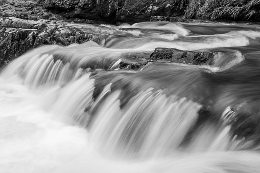Long exposure of a waterfall on the East Lyn river at Watersmeet in Exmoor national park