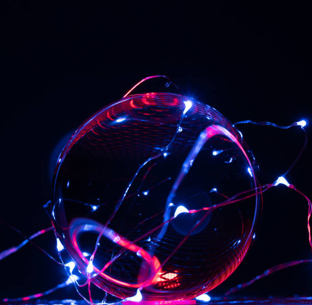 istock one perfect glass ball is illuminated by coloured lights 1216660401