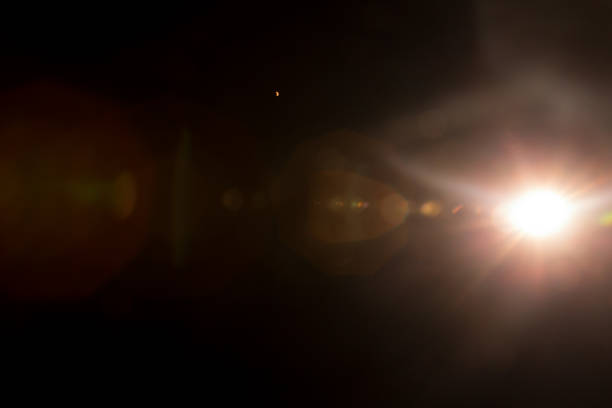istock Abstract Natural Sun flare on the black 1216660522