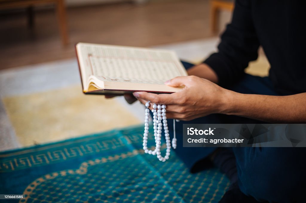 Muslims prayer at home Koran Stock Photo