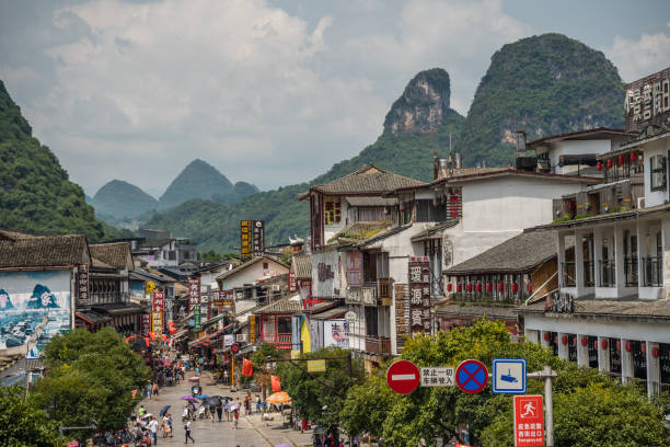 Yangshuo, China - August 2019 : Old town street lined with souvenir shops in the centre of  town, Guangxi Province