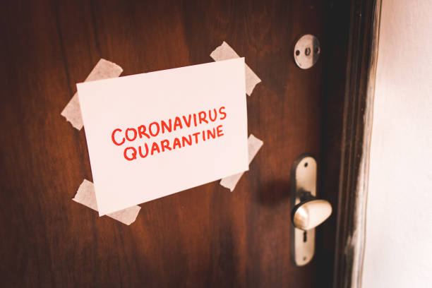 istock Coronavirus Quarantine Text on Paper Taped on the Door 1216662769