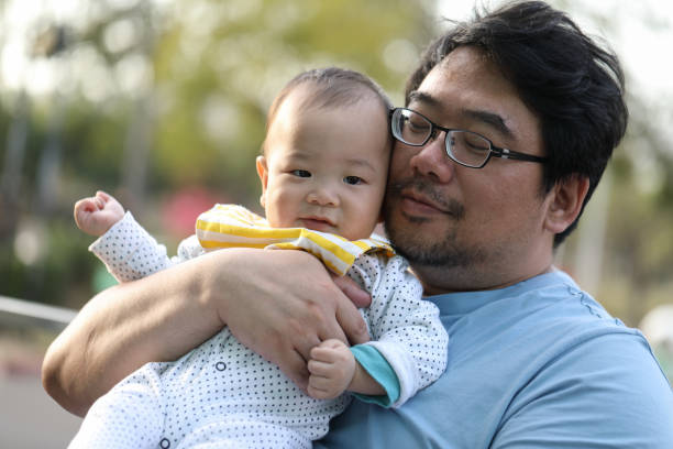istock Smiling baby and his father 1216662787