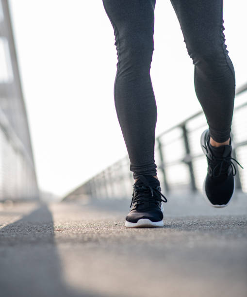 istock Close up of legs during run on the bridge 1216663672