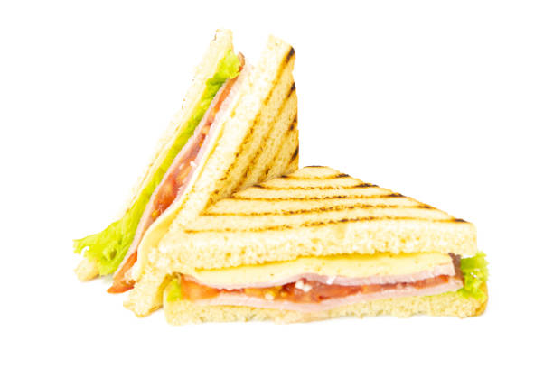 istock Sandwich with ham, cheese, tomatoes, lettuce, and toasted bread. Front view isolated on white background 1216663819