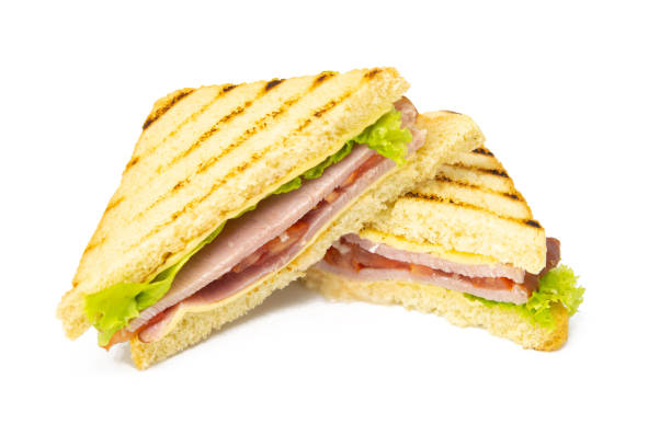 istock Sandwich with ham, cheese, tomatoes, lettuce, and toasted bread. Front view isolated on white background 1216663827
