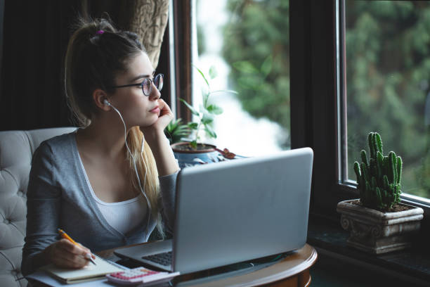 istock young woman working from home 1216663847