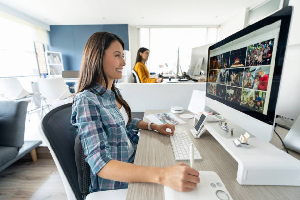 istock Happy graphic designer working at the office 1216664130