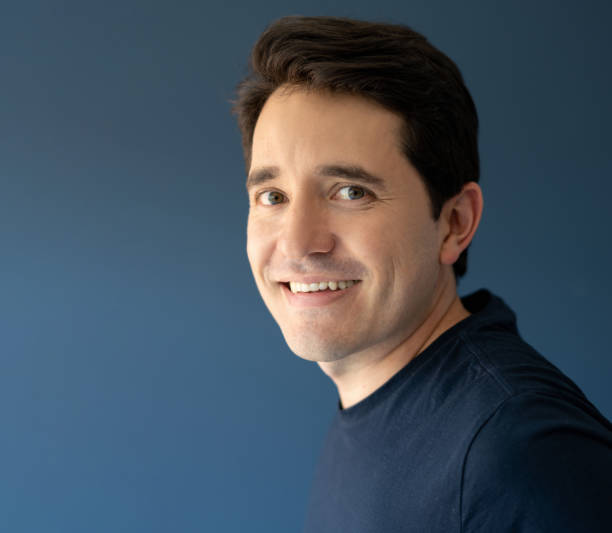 istock Portrait of a happy young man smiling 1216664264
