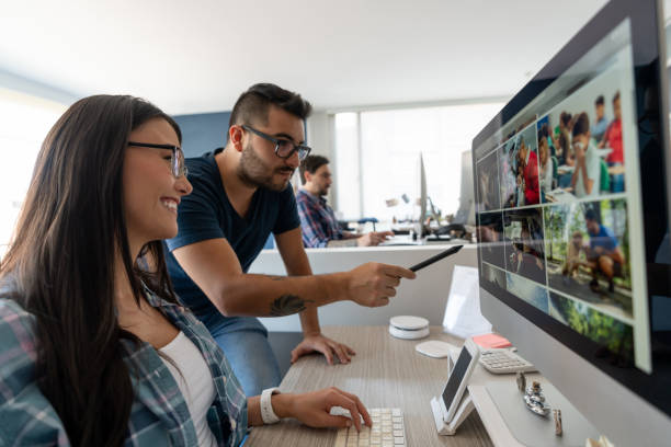 istock Team of graphic designers working together at a creative office 1216664692