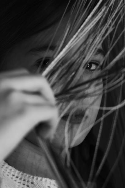istock Sad child looking out the window during the isolation and karantina. 1216664798