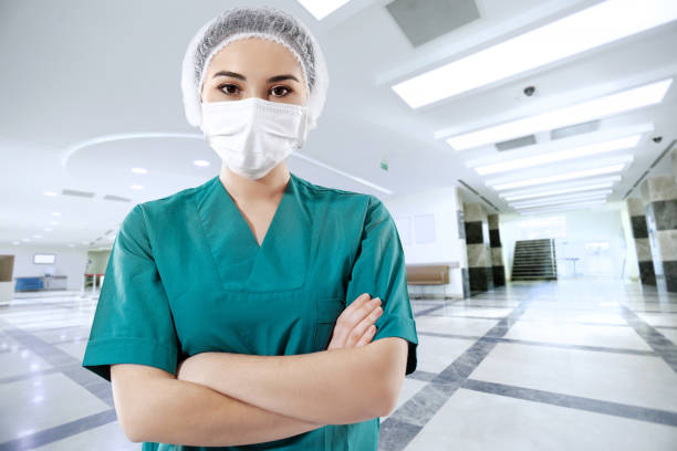 Healthcare worker with protective face mask in a hospital